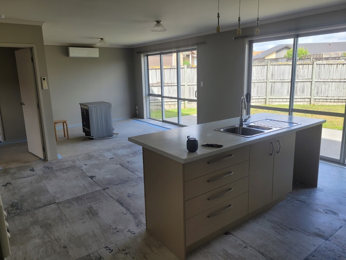 Large-format tiled floor through an open living area